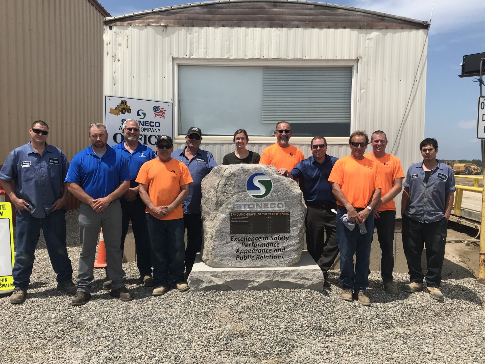 StoneCo employee group photo with Sand and Gravel of the Year award
